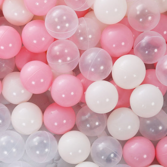 Close-up of pink, white, and clear plastic balls.