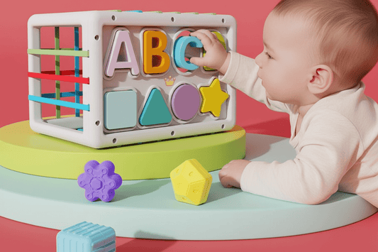 Baby playing with a colorful educational Baby Activity Cube - Montessori Learning Toy toy, learning ABC, shapes and colors