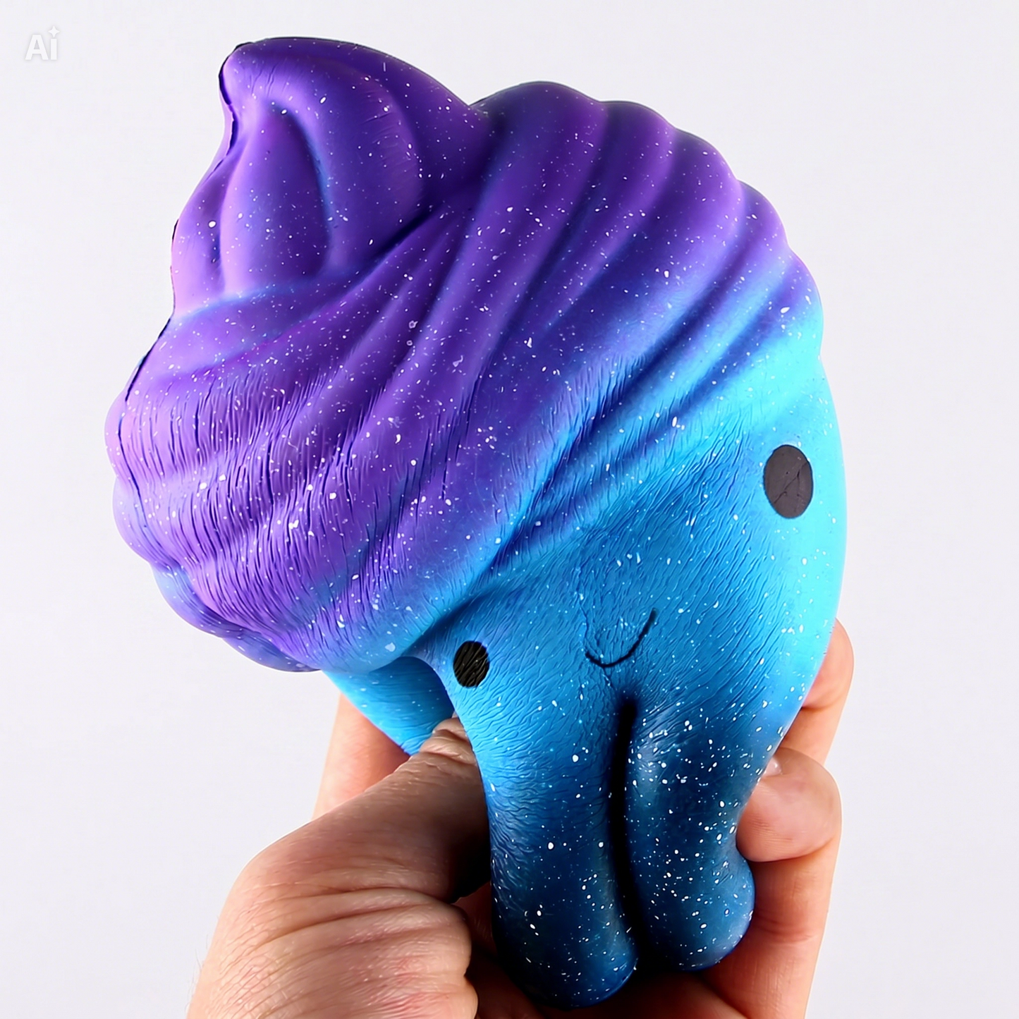 Purple and blue squishy toy held in a hand against a white background
