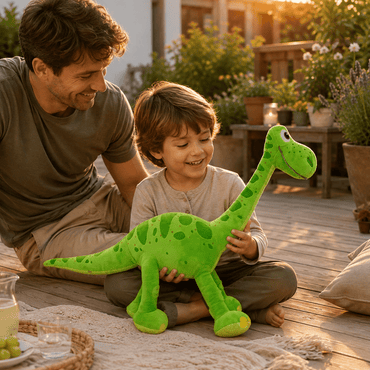 Father and son cuddling a green dinosaur plush toy on a porch