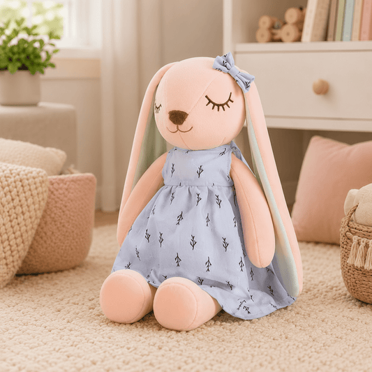 Plush toy rabbit in a blue dress