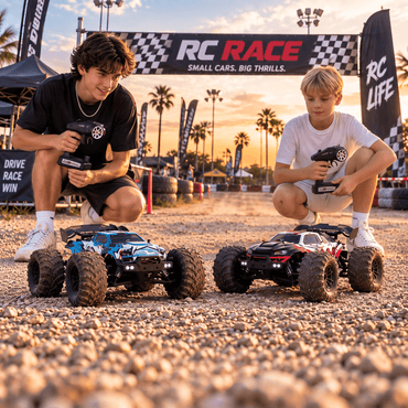 Two boys racing 4WD RC monster trucks at an outdoor RC track