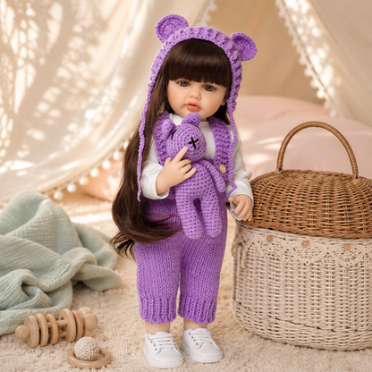 Liora reborn baby girl doll purple bear ear outfit styled in fairy light nursery setting lifestyle gift display