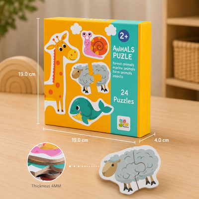 A children's wooden animal puzzle set in its yellow and teal box, shown on a light wood tabletop with dimension lines indicating 19.0 cm by 19.