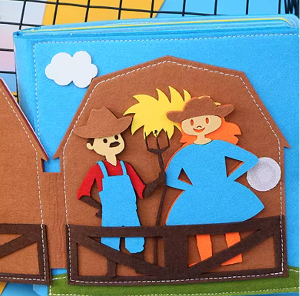 Children's soft ealy learning book with cowboy and cowgirl characters on a barn door