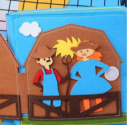 Children's soft ealy learning book with cowboy and cowgirl characters on a barn door