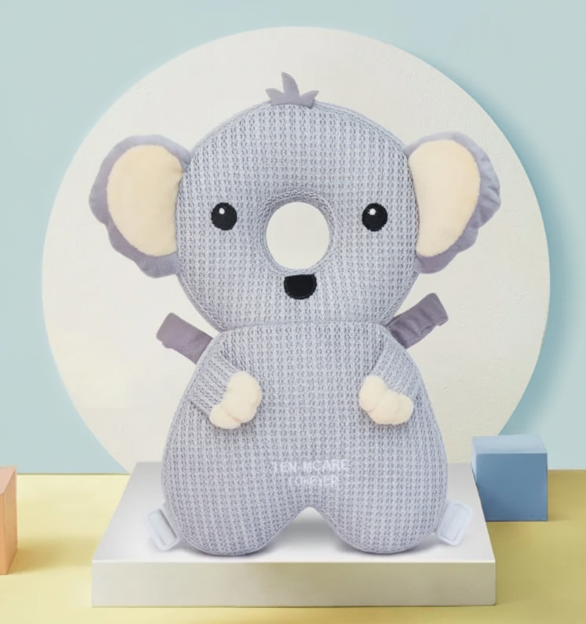 Knitted koala toy backpack head protector on a white stand with a light blue background