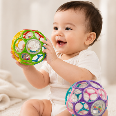 Baby holding a colorful toy with a soft white background