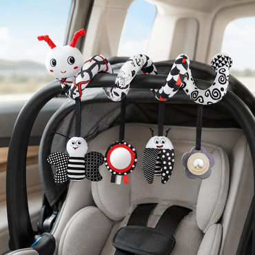 Car seat organizer with toy loop hanging on a car seat.