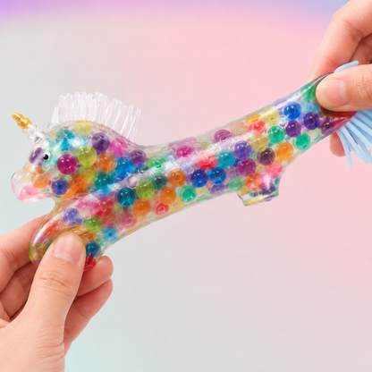 colorful unicorn squishy stretched by kids hands