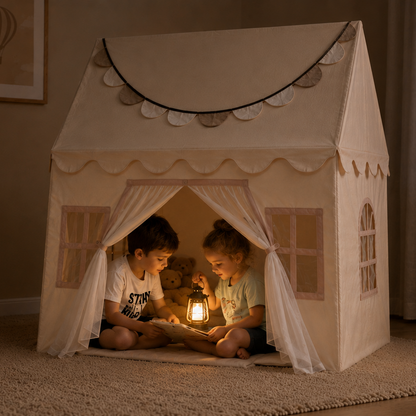 Two children playing inside a fabric playhouse with toys around, in a cozy room.