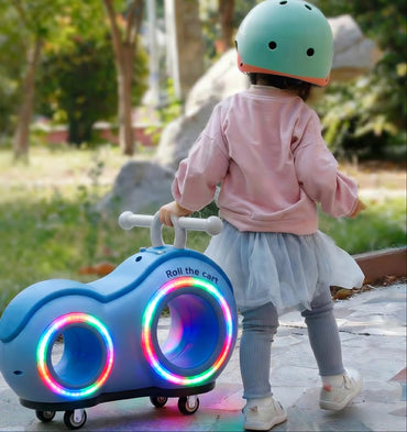 Roll_Glow_Ride-On_Car_For_Toddlers -Child pushing a colorful toy car with lights in an outdoor setting10