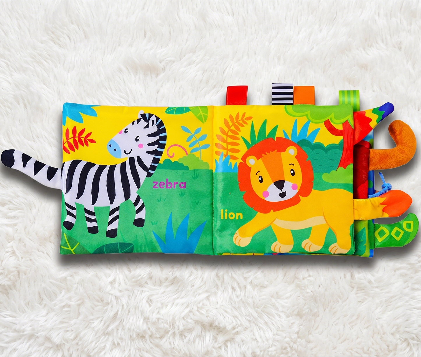 Colorful children's soft book with animal illustrations on a white surface