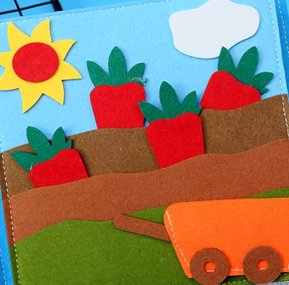 FarmBook vegetable garden page with pull-out felt carrots fine motor pincer grip harvest activity toddler