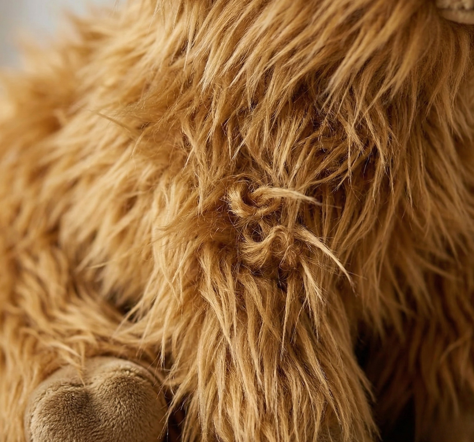 cow plush toy messy hair closeup