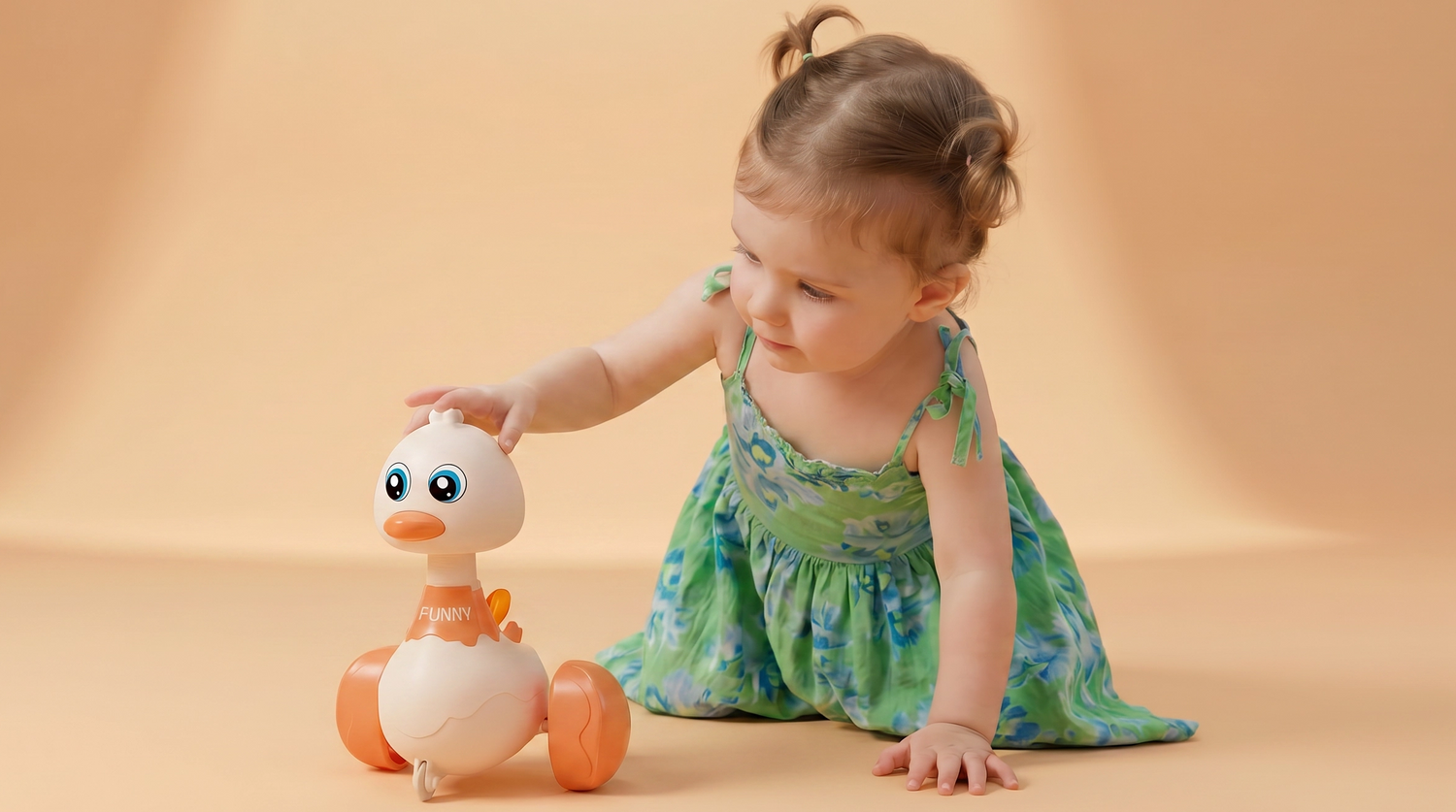 Child playing with a toy duck on a beige background