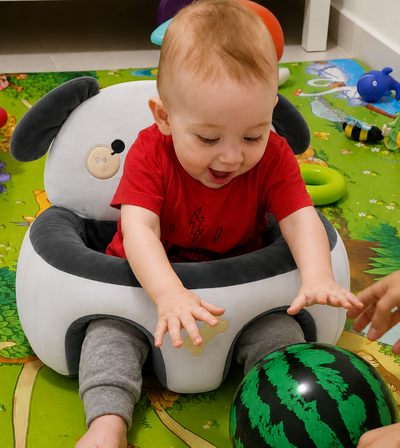 Child playing with a toy a support seat 