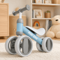 Blue baby balance bike, toddler first ride-on toy in nursery