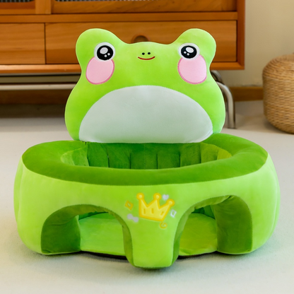 Green frog-shaped stool with a cartoon face on a light-colored floor.