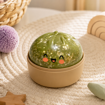 green glittery squishy for kids with smiling face