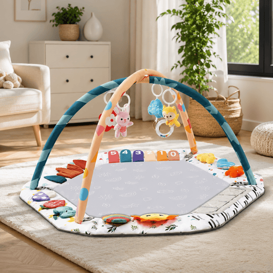 Hexagonal baby play gym mat with sensory toy arch displayed in a living room