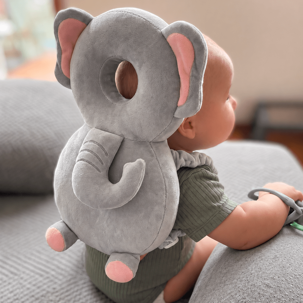 Walking Baby Pillow - baby wearing SafePals Velvet Elephant head protection backpack, grey and pink