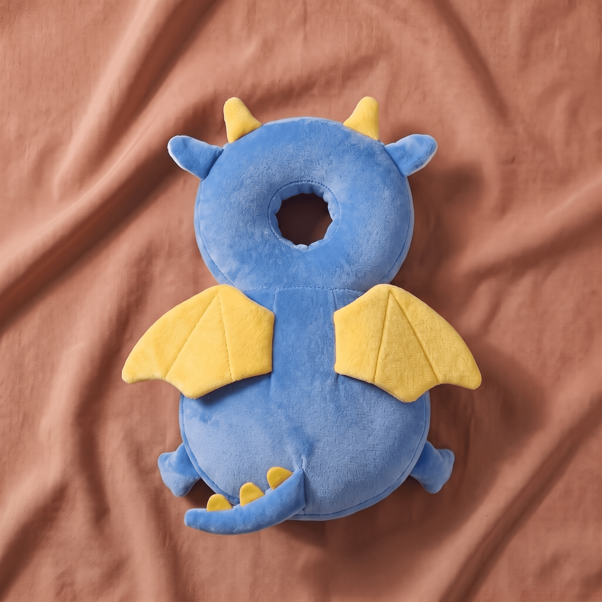 Baby Head Pillow Backpack - SafePals Velvet Dragon flat-lay studio shot, terracotta background