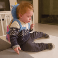 Baby Head Protector - blue dragon SafePals backpack lifestyle photo on toddler, front view