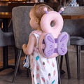 Baby Head Protector - toddler wearing SafePals mesh Butterfly backpack, velvet wrinkled straps, pink and purple