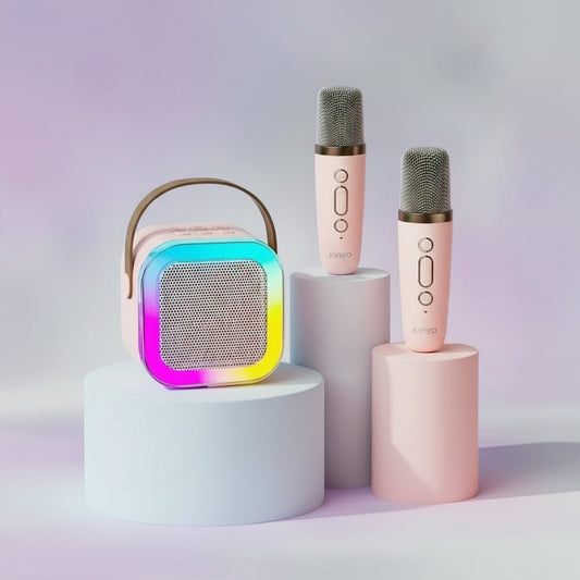 Colorful portable speaker and two pink microphones on a gradient background