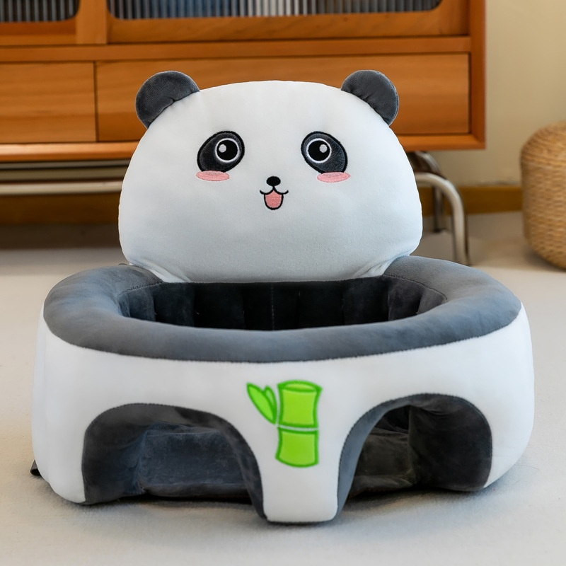 Plush panda chair with a bamboo design on a light-colored floor.