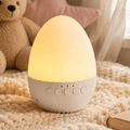 Portable baby sleep soother: egg sound machine and warm night light for travel and naps